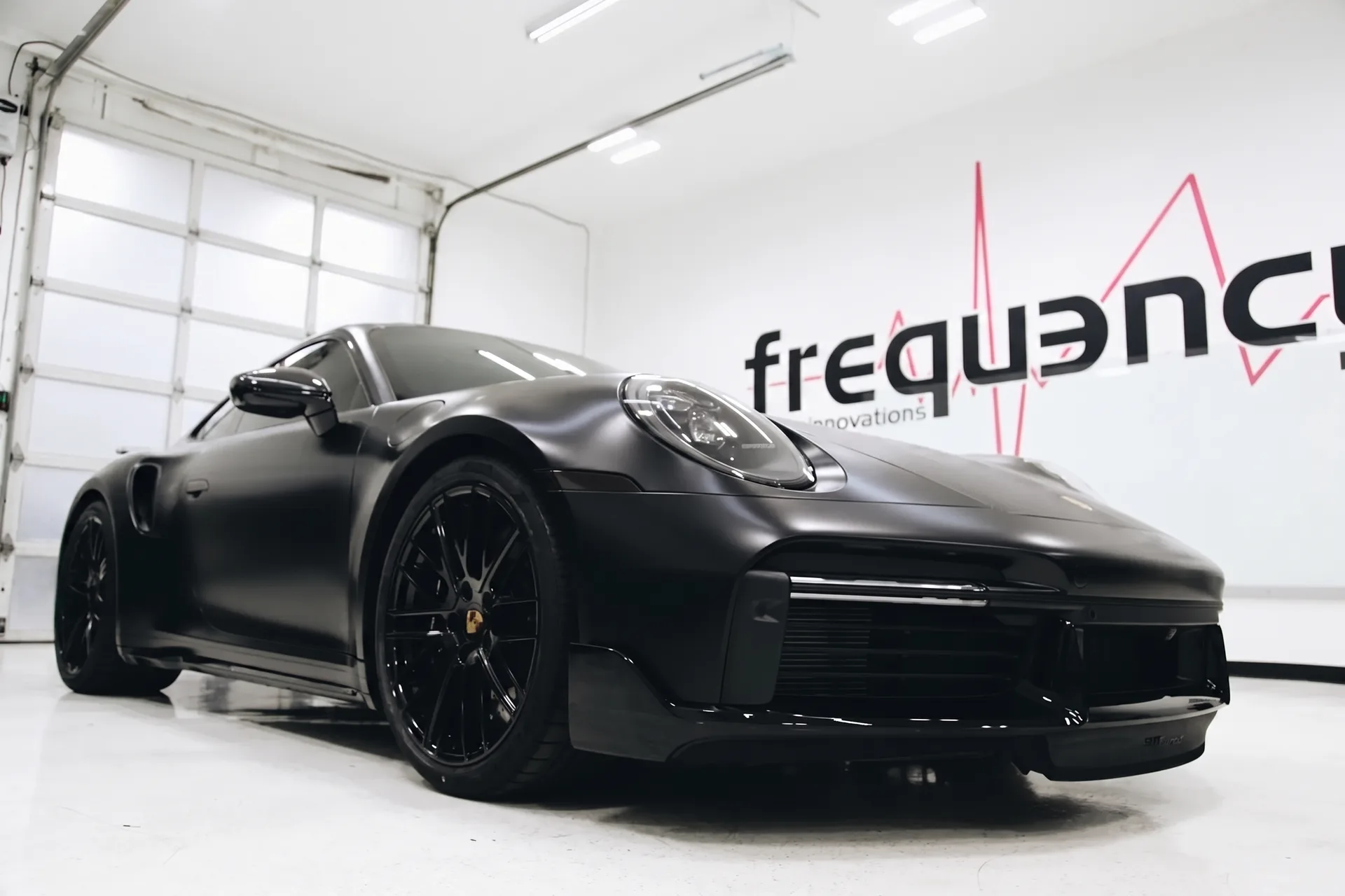 Matte black Porsche 911 with full paint protection film in the FRQNCY studio, Woods Cross UT